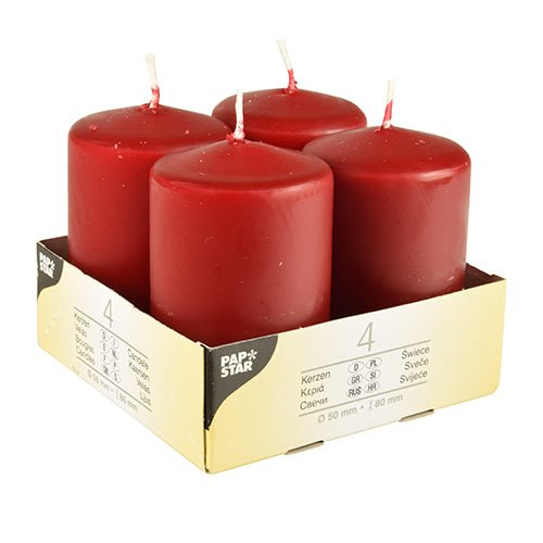 Fyra elfenbensfärgade Starpak blockljus (Ø 50 mm, 80 mm, platt topp) står upprätt i en beige kartonghållare med texten "Starpak". Förpackningen visar produktdetaljer, mängden 4 och betonar användningen av högkvalitativt vax.
