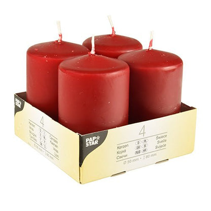 Fyra elfenbensfärgade Starpak blockljus (Ø 50 mm, 80 mm, platt topp) står upprätt i en beige kartonghållare med texten "Starpak". Förpackningen visar produktdetaljer, mängden 4 och betonar användningen av högkvalitativt vax.