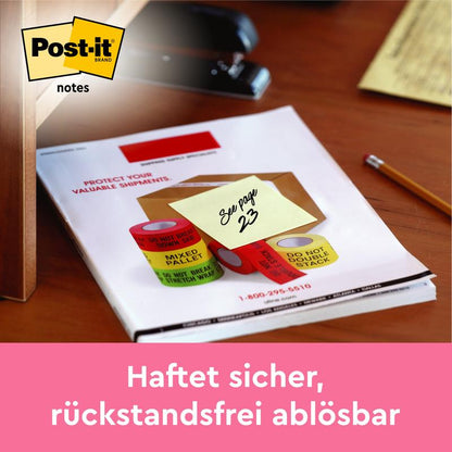 En 3M Post-it®-anteckning i gult (76x76 mm, 100 blad, 12 block/förpackning) med "Se sida 23" sitter säkert på ett dokument; idealisk för snabba anteckningar och avtagbar utan rester. Kartongförpackning, 100% PEFC-certifierad.