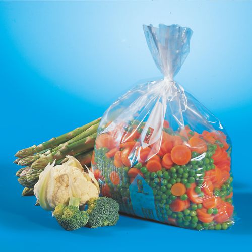 En transparent Starpak 45 fryspåse (LLDPE, 6 l, 46 x 30 cm), fylld med skivade morötter och gröna ärtor, presenteras bredvid färsk sparris, blomkål och broccoli - idealisk för förvaring i frysen. Vikbar kartong (45 stycken).