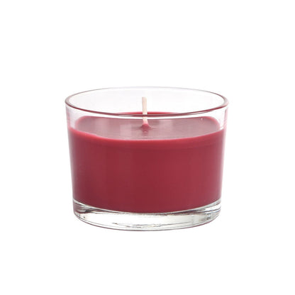 Glasljuset "Ibiza" från Duni GmbH (ca. 18h, 58 x 85 mm) med röd vax och vit veke ger stämningsfull belysning på vit bakgrund.