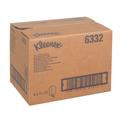 En vit kartong med texten "Kleenex® hår- och kroppsschampo" (produkt 6332) från Kimberly-Clark GmbH innehåller 6 x 1L-patroner för skonsam vård och effektiv rengöring, med flera streckkoder och tryckta produktdetaljer.