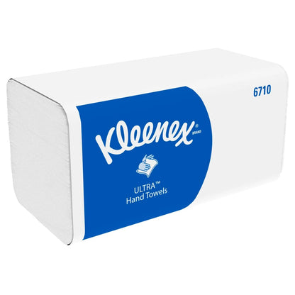 En rektangulär låda med Kleenex® Ultra™ vikta handdukar Interfold, vit, 15 x 96 ark från Kimberly-Clark GmbH - idealisk för hygienisk handtorkning, med blå etikett, varumärke, handsymbol och produktnummer 6710.