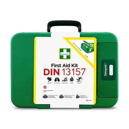 En grön Första hjälpen-låda DIN (förpackning, 1 styck) från Orkla Wound Care AB med handtag, vit frontplatta och symboler för sår, andning, cirkulation, brännskador och stukningar - idealisk som kompakt DIN-nödsats.