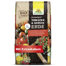 Auf der Verpackung eines Beutels Neudorff Shop NeudoHum Tomaten- & GemüseErde, torffrei und biologisch, sind Tomaten und Sommergemüse abgebildet. Mit extra Kalium ist sie ideal für Hochbeete und unterstützt ein gesundes Gemüsewachstum.