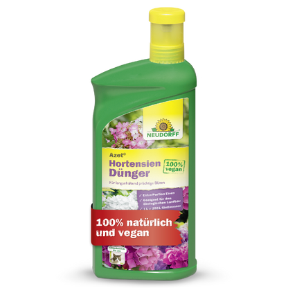 Eine grüne Flasche Neudorff Shop Azet HortensienDünger flüssig mit einer gelben Kappe. Das Etikett zeigt Blumen und die deutschen Sätze "100% vegan" und "100% natürlich und vegan".