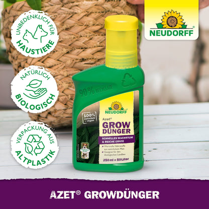 En grön flaska Azet GrowGödning från Neudorff Shop vilar på en vit träyta, där symboler för miljö- och djurskydd visas. Etiketten marknadsför naturliga, biologiska ingredienser och en förpackning av återvunnen plast.