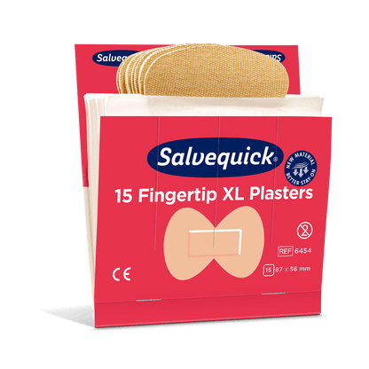 En förpackning Orkla Wound Care AB XL Fingerspets Textilplåster (15 stycken/min | förpackning, 6 stycken) med flexibla beige plåster i en röd-vit ask, varje plåster är 87 x 56 mm stort.