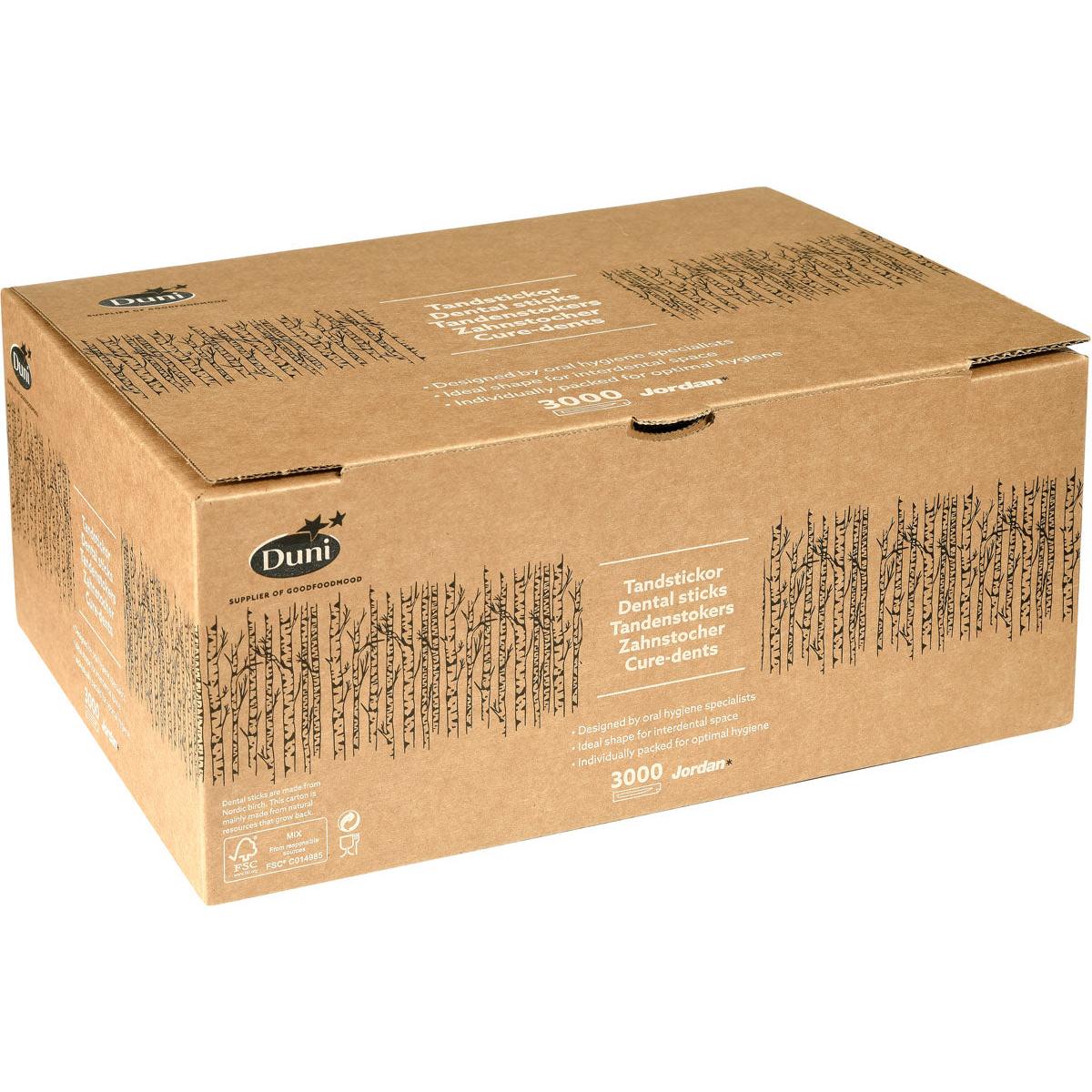 En stor brun låda med texten "Duni GmbH" innehåller 3 000 tandpetare Neutral Trä 50, med produktinformation på flera språk och ett svart trädmönster på sidorna.