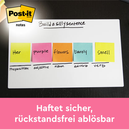 Auf einem Whiteboard zeigen fünf Post-it® Notizen der 3M Deutschland GmbH aus der Energetic Collection (76 x 63,5 mm) jeweils "Ihre lila Blumen duften kaum" unter "Bilde einen dummen Satz". Das Post-it Logo und der Slogan 100% PEFC, SGSCH-PEFC-COC-110078 sind abgebildet.
