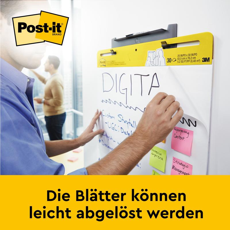 En användare skriver på ett Post-it® Super Sticky självhäftande mötesblock/flipchart från 3M Deutschland GmbH (58,4 x 50,8 cm), där flera notislappar är fästa. Under står det: "Bladen kan enkelt tas bort."