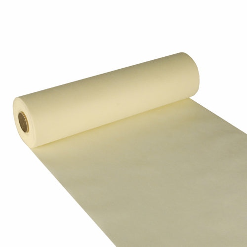 Starpak bordsduk, tygliknande nonwoven "soft selection" (24 m x 40 cm), i ljusgult är här delvis utrullad med synlig innercylinder – perfekt som elegant bordsduk för stilfulla miljöer.