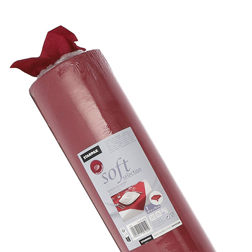 En delvis uppackad rulle röd Starpak-bordsduk, tyg-liknande fleece "Soft Selection", med en etikett med bruksanvisningar och bilder av en bordsdekoration.