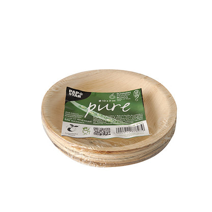 En stapel PAPSTAR skålar av palmblad "pure" rund, 13 cm, miljövänlig (6 stycken) från PAPSTAR GmbH är förpackad i krympfolie - idealisk hållbart engångsservis för miljömedvetna tillfällen.