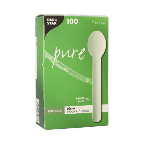 En vit låda med texten "PAPSTAR Pure" innehåller 100 miljövänliga engångssked av papper (15,5 cm), alla biobaserade och tillverkade av PAPSTAR GmbH. Framsidan visar en sked och påpekar det miljövänliga pappermaterialet.