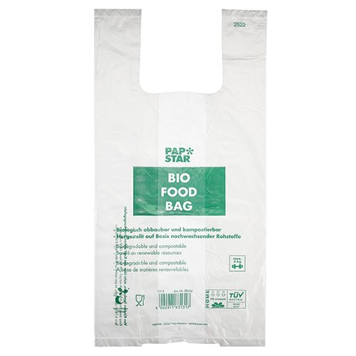 De 100 skjortbärväskorna från PAPSTAR GmbH är transparenta, biologiskt nedbrytbara biofoliepåsar på en rulle med grön "PAP STAR BIO FOOD BAG"-text och flerspråkig information om komposterbarhet och förnybara råvaror.