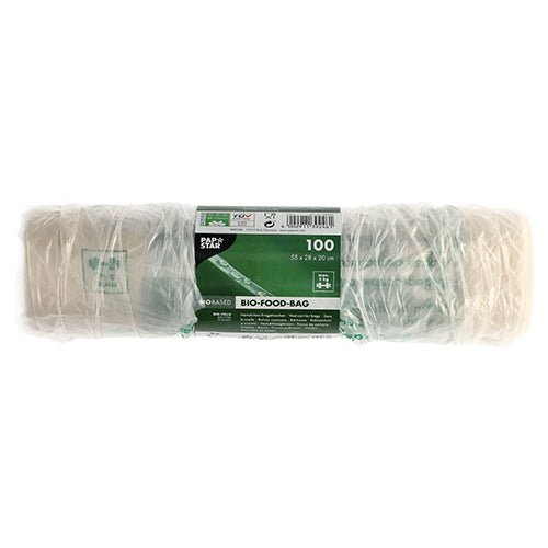 En rulle med 100 PAPSTAR skjortbärväskor av transparent biofolie (knutpåse) är förpackad i folie och har en grön och vit etikett med produktdetaljer samt miljövänliga symboler.