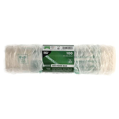 En rulle med 100 PAPSTAR skjortbärväskor av transparent biofolie (knutpåse) är förpackad i folie och har en grön och vit etikett med produktdetaljer samt miljövänliga symboler.