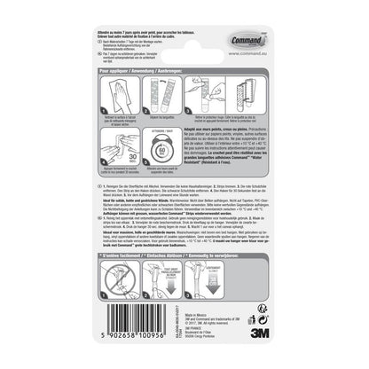 Baksidan av en förpackning med Command™ Canvas Hängare från 3M Deutschland GmbH innehåller en illustrerad bruks-/borttagningsanvisning på fyra språk, en streckkod längst ner, tillverkarens information och 3M-logotypen.