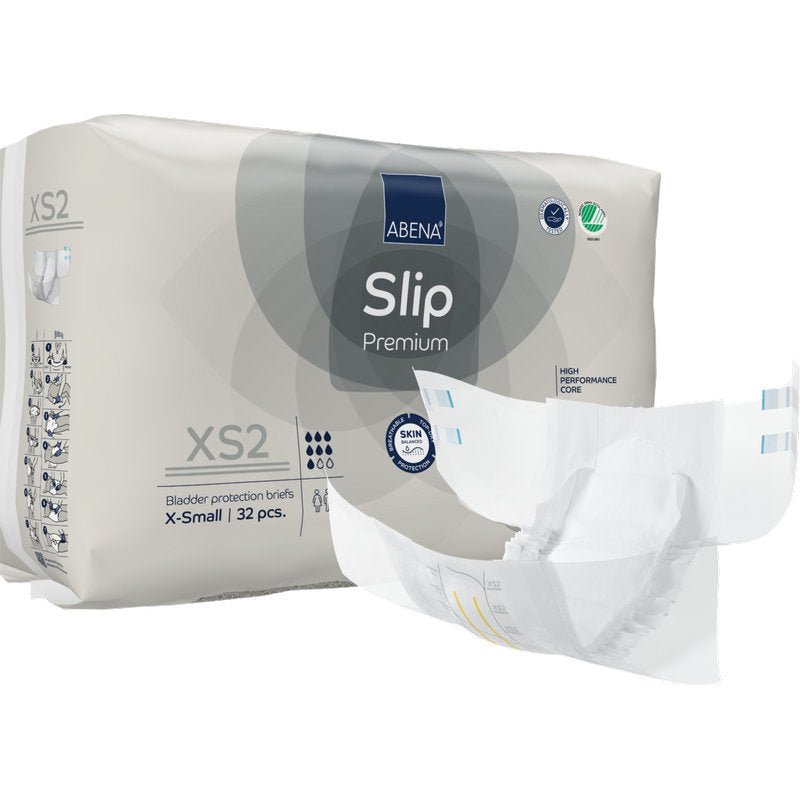 Ett paket ABENA Slip Premium från Abena Re-Seller GmbH, storlek X-Small, med 32 skydd. Ett skydd visas utfällt på framsidan och visar dess design för effektiv inkontinensvård.