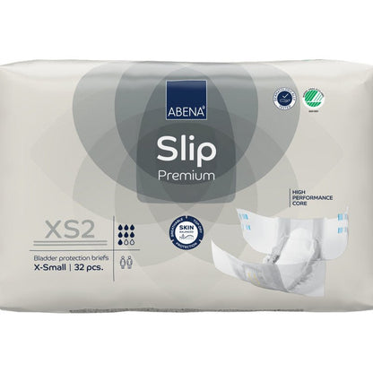 Ett 32-pack ABENA Slip Premium från Abena Re-Seller GmbH i storlek XS2 X-Small i beige förpackning med certifieringarna "High Performance Core" och "Skin Friendly" för pålitlig inkontinensvård.