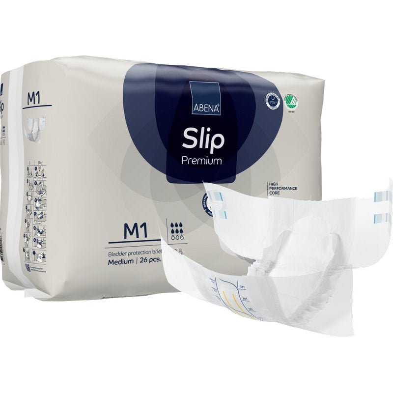 Avbildat är ett paket med texten "ABENA Slip Premium" från Abena Re-Seller GmbH med ett utfällt skydd i förgrunden. Paketet innehåller 26 medelstora stycken för pålitlig inkontinensvård.