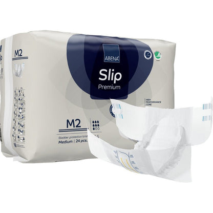 Bakom ett utfällt skydd är ett paket ABENA Slip Premium från Abena Re-Seller GmbH, storlek M2, avbildat. På förpackningen anges att den innehåller 24 medelstora skydd för pålitlig inkontinensvård.