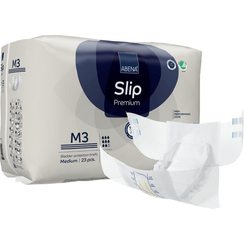Avbildat är ett paket ABENA Slip Premium från Abena Re-Seller GmbH med ett medium skydd utanför förpackningen. Paketet innehåller 23 skydd för pålitlig inkontinensvård.