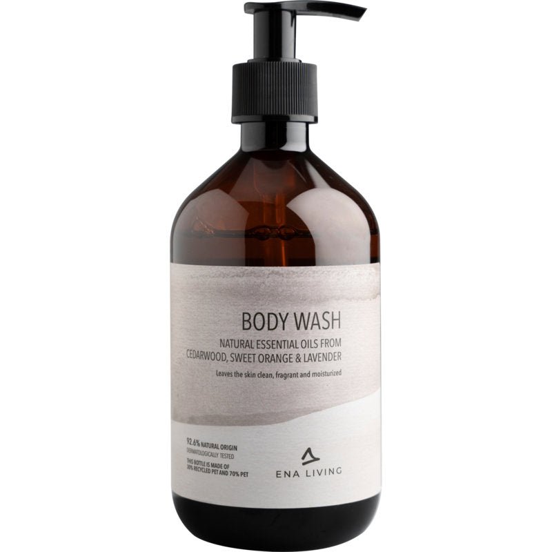 ENA Living Body Wash, 500 ml från Abena Re-Seller GmbH (kartong med 8 förpackningar), vårdar återfuktande med eteriska oljor från cederträ, apelsin och lavendel. Den vita designen betonar den mjuka kroppstvättlotionen.