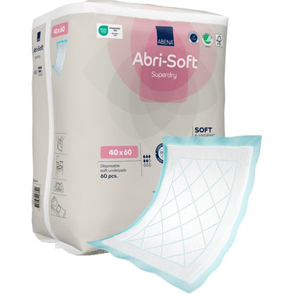 Ett paket med Abena Re-Seller GmbH engångsunderlägg, Abri-Soft Superdry, Blå, 40x60 cm, 60 stycken - idealiskt för vårdinrättningar. Ett underlägg med vit absorptionsyta och blå kanter är synligt utanför förpackningen.