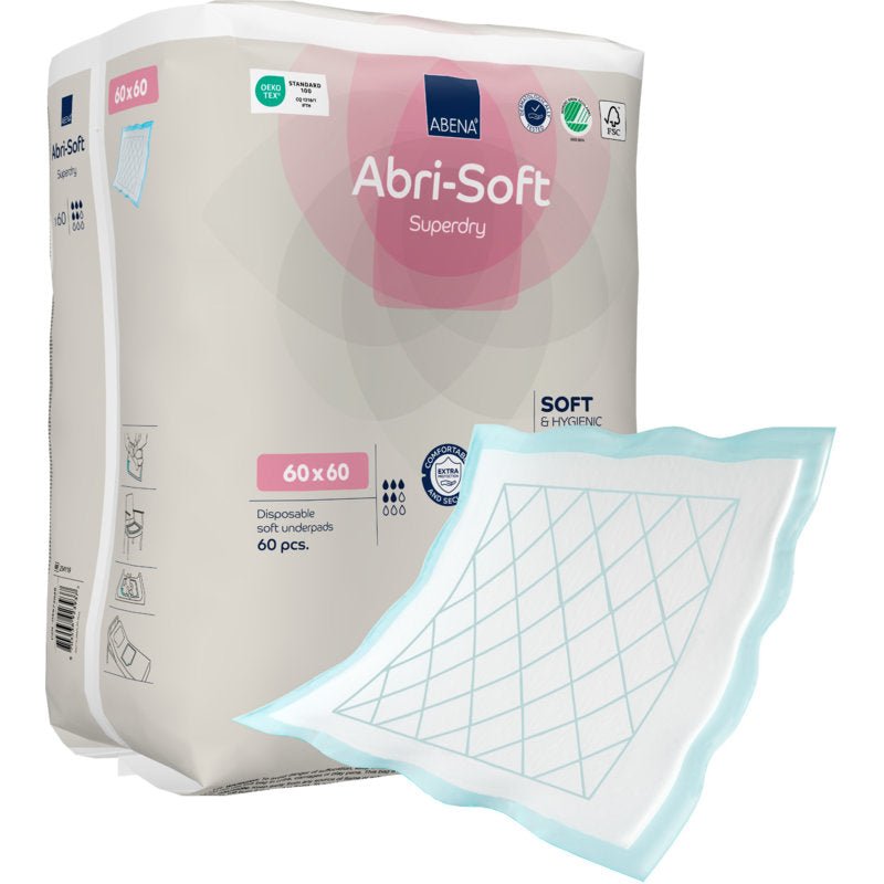 Visas är ett paket med texten "Engångsunderlägg, Abri-Soft Superdry, Blå" från Abena Re-Seller GmbH (60 x 60 cm, 60 stycken). Ett inkontinensunderlägg med blå kant och rutmönster ligger utanför paketet.