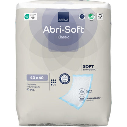 En förpackning med 60 Abena Re-Seller GmbH engångsunderlägg, Abri-Soft Classic, 40x60 cm, blå. Den övervägande vita och ljusgrå förpackningen betonar mjukheten, det vattentäta underlägget och det extra skyddet.