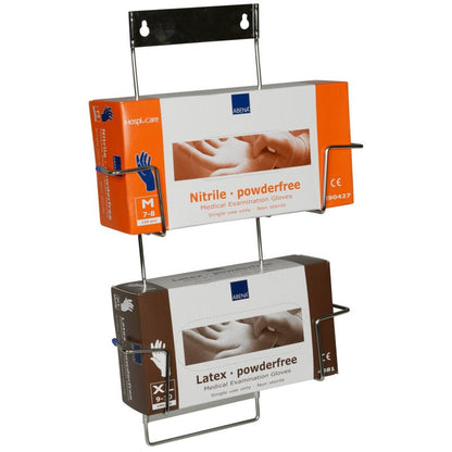 Flexi Rack från Abena Re-Seller GmbH är en väggmonterad metallhållare för handsksboxar, här med två medicinska engångsundersökningshandsksboxar: en orange med texten "Nitril puderfri" och en brun med texten "Latex puderfri".