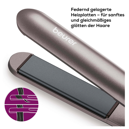 En närbild av en Beurer HS 15 plattång. Bilden framhäver de fjäderbelastade värmeplattorna med keramisk beläggning, som är designade för en mjuk och jämn hårutjämning. Ett infogat diagram visar hur plattorna jämnar ut håret. En tysk text från Beurer GmbH beskriver funktionen.