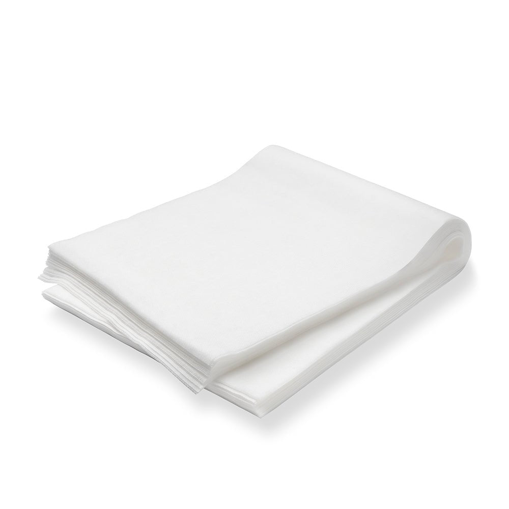 En förpackning med 100 TASKI dammdukar (60 x 25 cm, oljedränkta) från Diversey Deutschland GmbH & Co. OHG är prydligt staplad på en vit yta - idealisk för daglig vård och dammborttagning på belagda och obelagda golv.