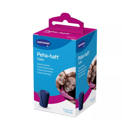 En produktförpackning för Hartmann Peha-haft Color elastisk fixeringsbinda, blå, från Paul Hartmann AG, bestående av en blå-rosa låda med bilden av två leende kvinnor och en synlig rosa bandagerulle.