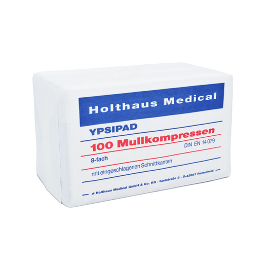 Eine Schachtel Holthaus Medical YPSIPAD Mullkompresse, 100 Stück, mit dem Text, der 100 Stück angibt, gemäß der Norm EN 14079. Die Verpackung ist hauptsächlich weiß und blau und beschriftet.