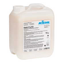 Ein 5-Liter-Kanister Kiehl-PurOil wasserbasiertes imprägnierendes Pflegeöl Ecolabel der Johannes Kiehl KG mit Griff und Schraubverschluss, weißem Etikett mit Produktinformation, Sicherheitsangaben, Ecolabel-Zertifizierung und deutschem Branding. Verpackt als 2 Flaschen in einem Karton.