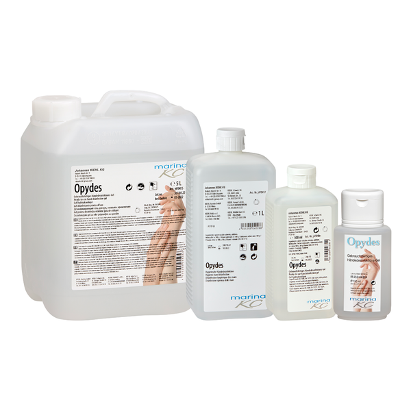 Avbildade är fyra klara flaskor av Kiehl Opydes Hygienische Händedesinfektion från Johannes Kiehl KG i olika storlekar i rad. De har vit och blå text med handsymboler för hygienisk handdesinfektion och bakterieminskning.