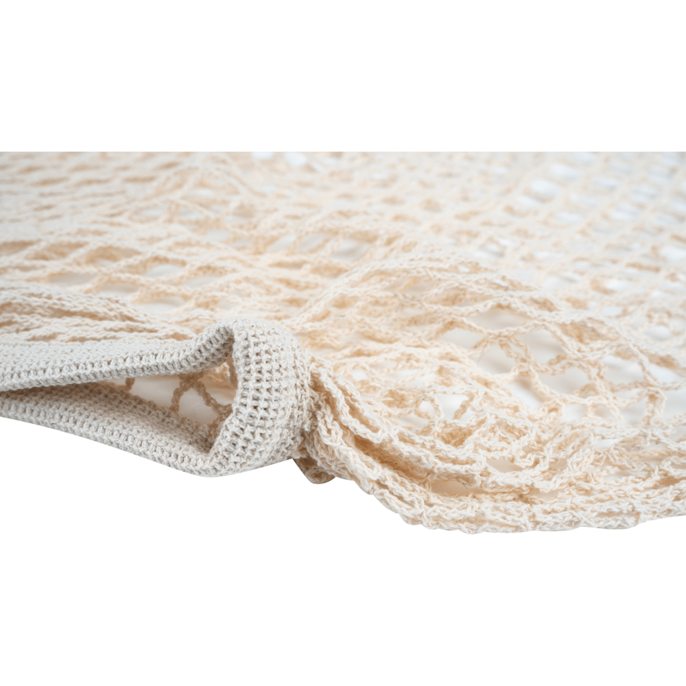 Närbild av ett beige ENA Living shoppingnät från Abena Re-Seller GmbH - löst vävt, återanvändbart nät, idealiskt för miljövänlig shopping; finns i kartong med 24 förpackningar.