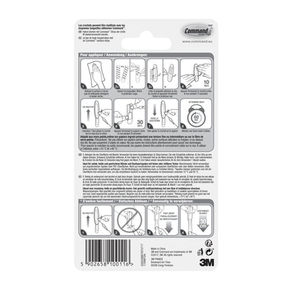 Die Rückseite des Command™ Medium Drahthakens, 17068 von 3M Deutschland GmbH zeigt eine Anleitung zum beschädigungsfreien Aufhängen mit Klebetechnologie, Schritt-für-Schritt-Abbildungen, mehrsprachigen Text und einen Barcode am unteren Rand.
