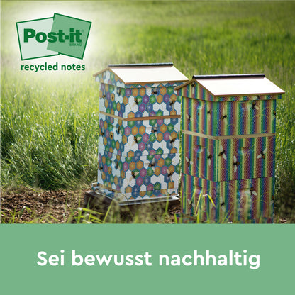 Zwei lebendige Bienenstöcke sitzen in einem grasbewachsenen Feld. Oben links ist das Post-it® Recycling Notes (76 x 76 mm, 100 Blatt/Block, 100% PEFC) Logo der 3M Deutschland GmbH zu sehen. Der untere deutsche Text lautet: "Sei bewusst nachhaltig.