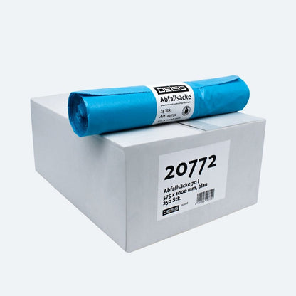 På en vit kartong med texten "20772" ligger en rulle blå soppåsar, kända för sin slitstyrka. Kartongen innehåller 25 soppåsar från DEISS LDPE soppåse Typ 60-kollektionen med måtten 575 x 1100 mm. På etiketten syns varumärket "EMIL DEISS KG (GmbH + Co.)".
